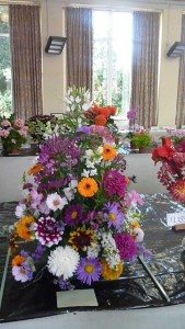 Container of mixed flowers
